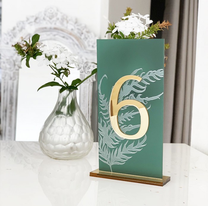 Emerald and gold engraved table number