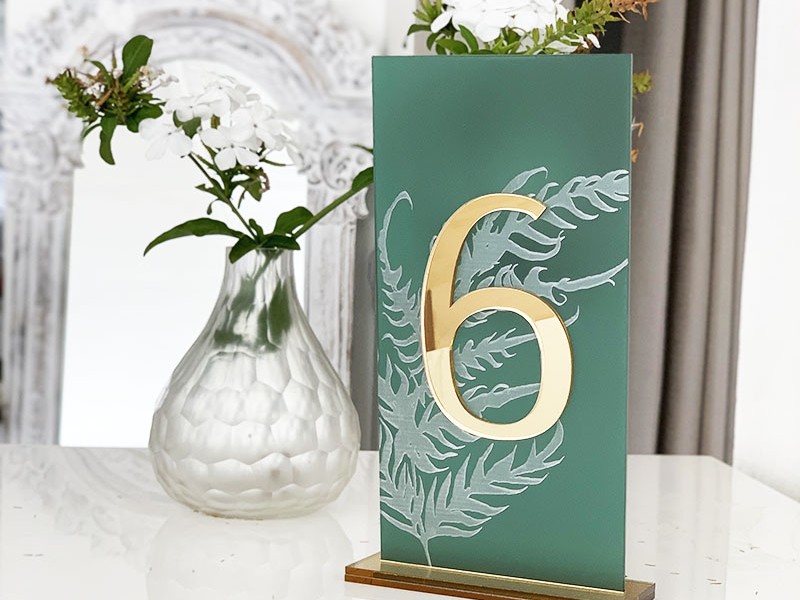 Emerald and gold engraved table number