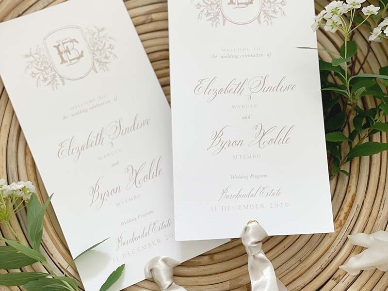 Elizabeth and Byron program cards with ribbon