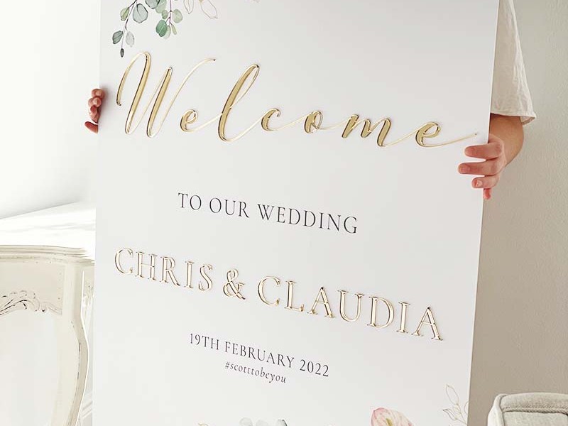 Claudia-Chris-welcome-board