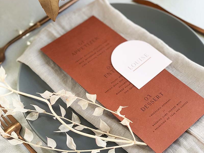 Rust menu card with bluch arched place card