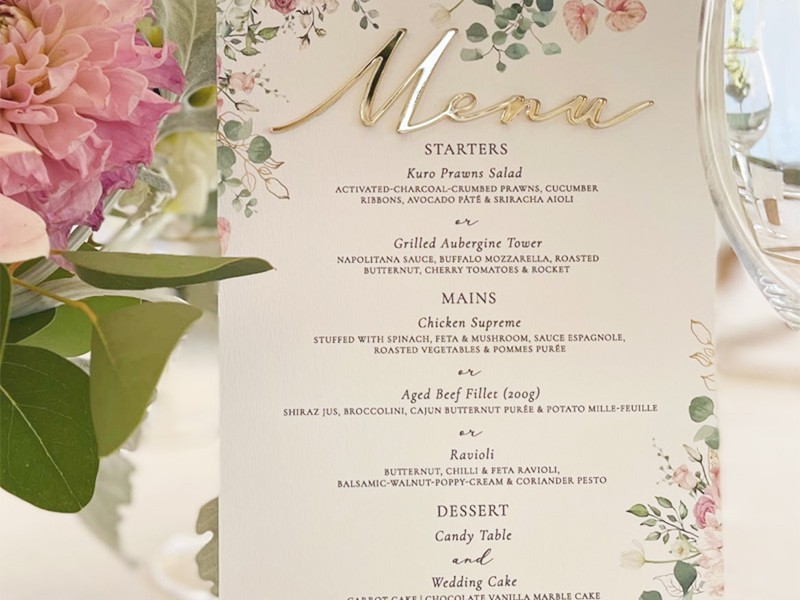 Floral and acrylic table menu
