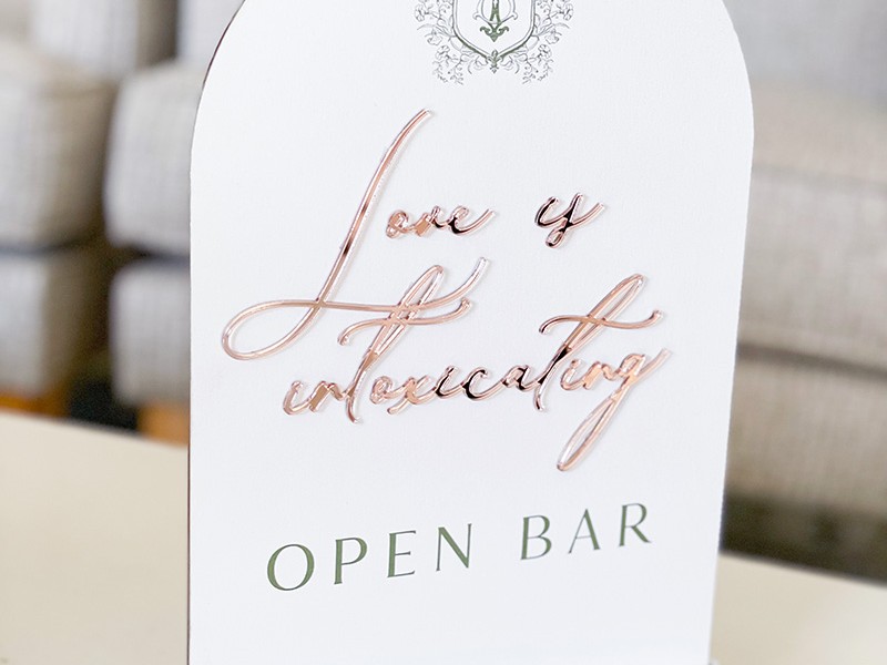 Shelby and Thomas open bar sign