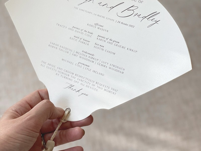 Kathryn and Bradley program fan