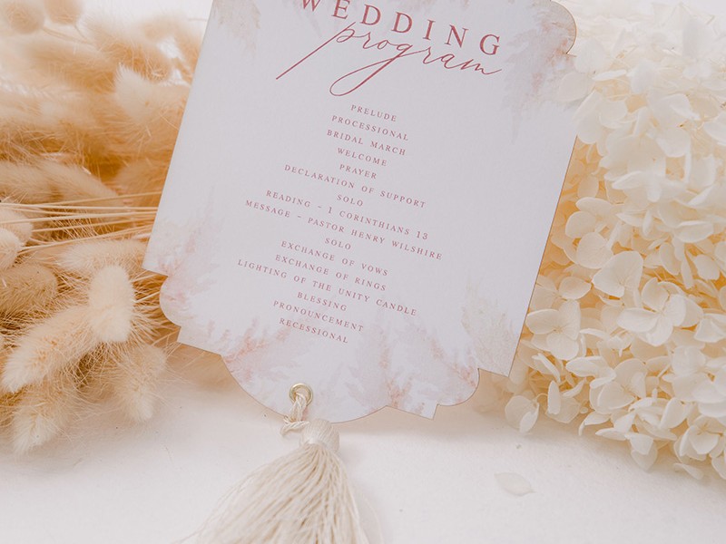 Ornate shaped program with tassel