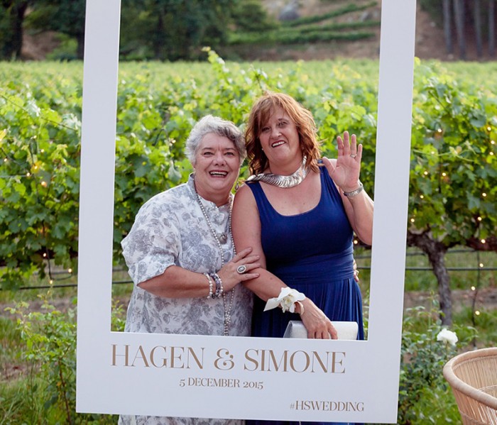 Simone and Hagan polaroid photo sign