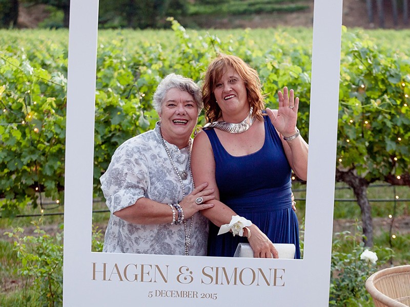 Simone and Hagan polaroid photo sign