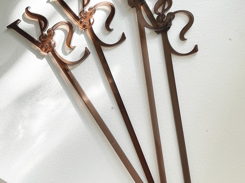 Vanessa and Chuka swizzle sticks