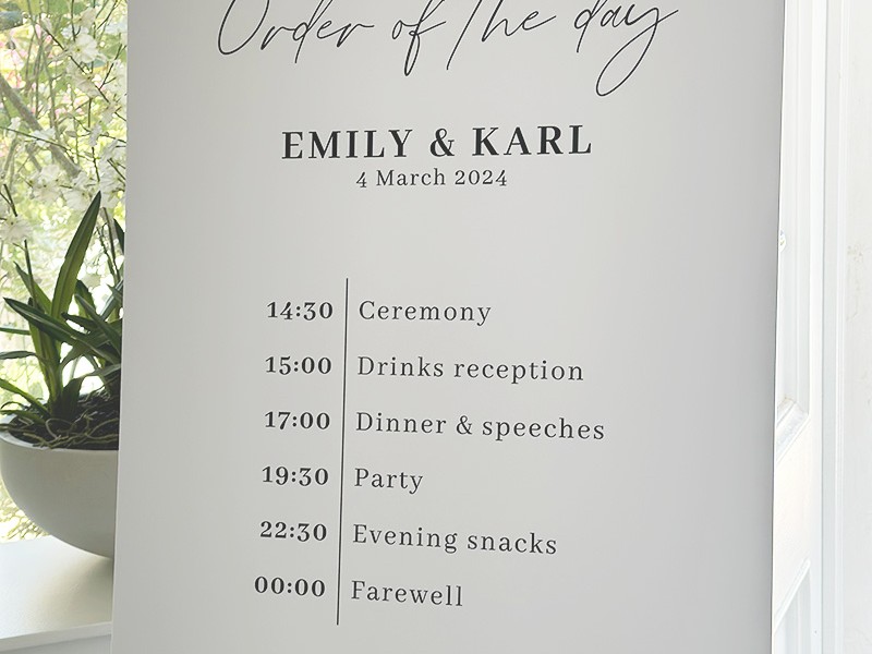 Emily & Karl order of the day sign