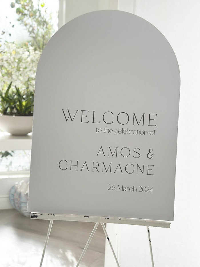 Charmagne and Amos arched welcome sign