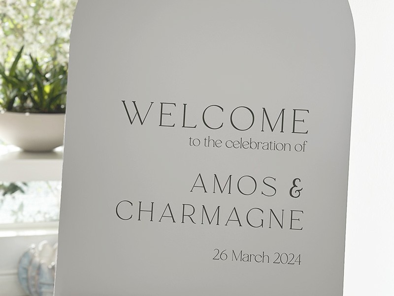 Charmagne and Amos arched welcome sign