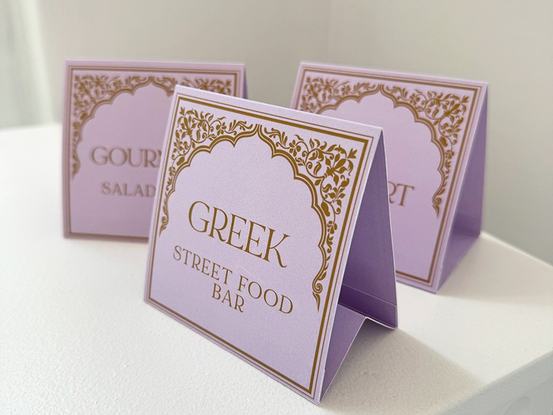 Brij and Rianna food station signs