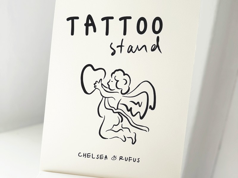 Chelsea and Rufus tatoo stand sign